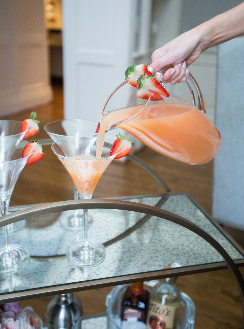 Pouring strawberry martinis by Fashionable Hostess