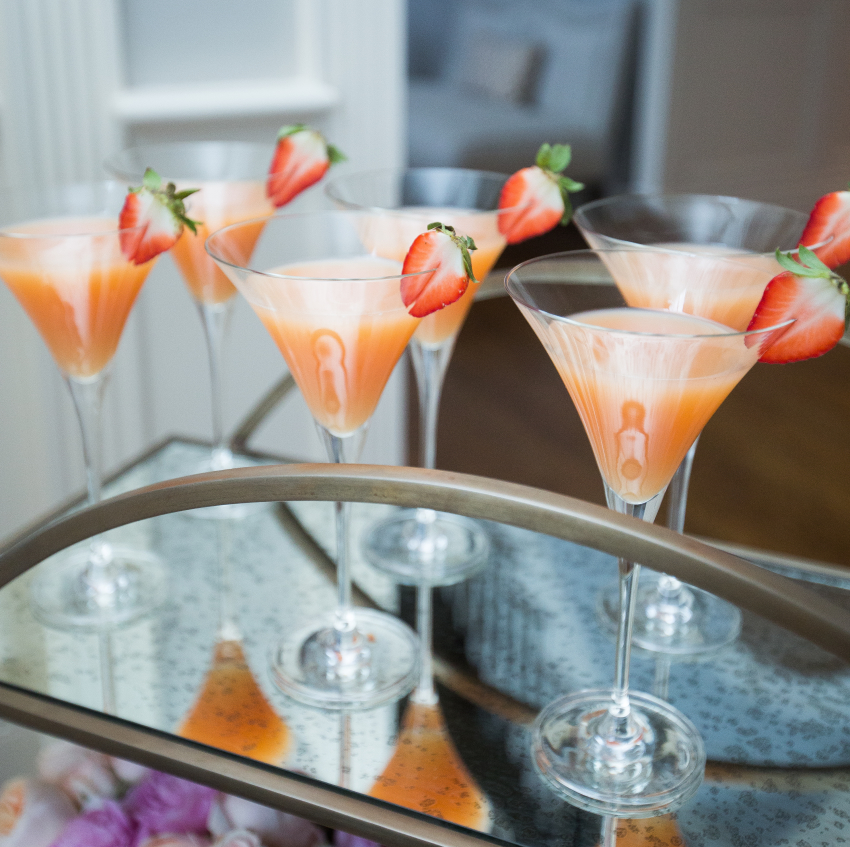 Strawberry martinis with fruit garnish