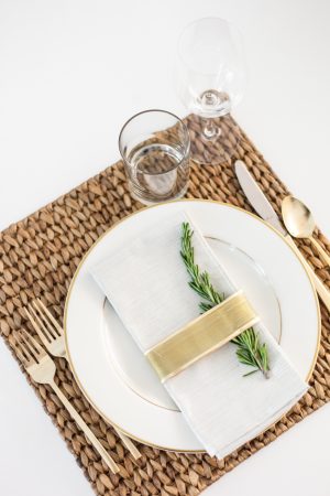 DIY Place card settings for the Holidays using Rosemary and gold ribbon + gold silverware