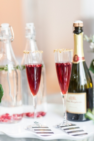 Fashionable Hostess- Gold sugar rims of Pomegranite Champagne Cocktail - Holiday Cocktail Idea