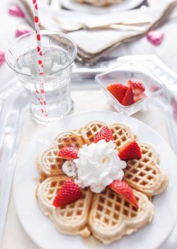 Waffles with whipped cream and strawberries for Valentine's Day Breakfast in bed by Fashionable Hostess