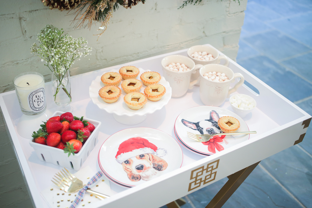 Tray by Rachel George with Diptyque Candle, Crate and Barrel Glass Fruit Carton, Pier 1 Puppy Christmas Plates, Pier 1 Cake Stand, and Pier 1 Abigail Mugs with Hot Cocoa on Fashionable Hostess