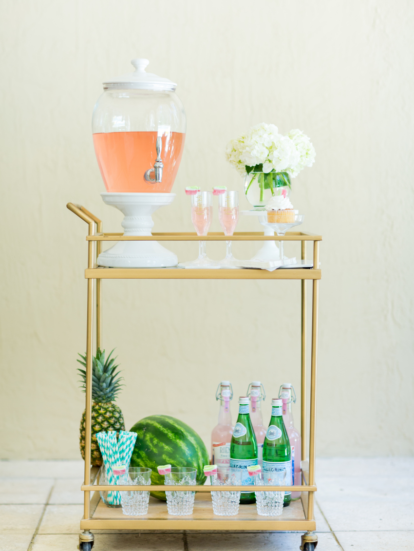 Gold Bar Cart Display for Spring with summer drink dispenser and decorative objects on FashionableHostess.com